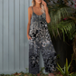 Női nyomott mintás, spagettipántos, széles szárú jumpsuit